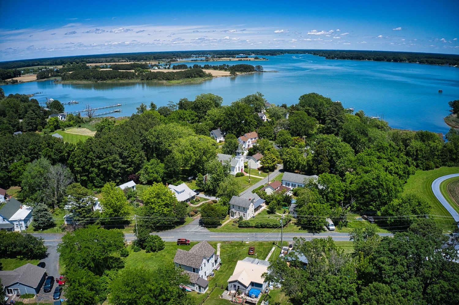 Sherwood’s historic village displays diverse architectural styles framed by mature trees and nestled around Harris Creek.